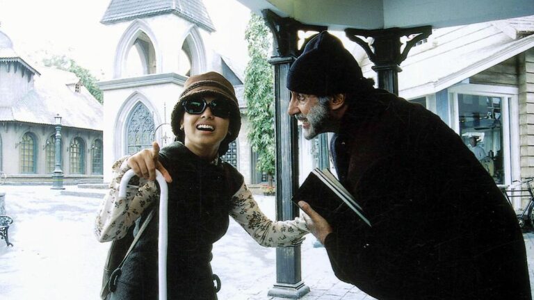 Articles A person helping a woman with disability